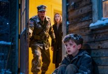 The little boy stood trembling in the heavy snow, his small hands purple from the cold, his cheeks covered in dark bruises. His stepmother shouted: “Stand there all night so you learn your lesson!” The boy sobbed: “I’m so cold… I’m sorry…” At that very moment, the door burst open. His father—a soldier—had come home early. He froze in horror when he saw his son on the verge of collapsing. He roared, his voice shaking with fury: “What have you done to my son?!” The stepmother’s face turned deathly pale—and in that instant, she knew… her reckoning had begun.