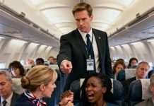 When the baby cried from an earache, the Black mother tried to soothe her child, but the flight attendant rushed over, yanked her hand away, and snapped, “You’re disturbing the other passengers. Behave yourself!” A sudden slap left the entire cabin in stunned silence—everyone turning their faces away as if nothing had happened. In the row ahead, a man in a suit slowly stood up. He held out his work badge to the attendant and said coldly, “I’m a senior HR executive for this airline. And you’ve just violated our most serious policy.” The air froze instantly.