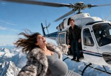 Just as the helicopter lifted off the coast, my husband leaned close and whispered, “Goodbye, love… and thanks for the insurance money.” Before I could react, one brutal shove sent me—his pregnant wife—tumbling out of the aircraft and crashing into the waves below. He thought the ocean had erased every trace. But when he returned to the hotel that night, the dark room suddenly flickered to life with a familiar recording: “You really think I didn’t keep a copy of your plan?” His victorious grin collapsed instantly as I stepped into the doorway, dripping seawater, with two officers behind me and every secret he hid finally closing in on him.