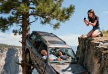 My daughter had cut the brake lines. When the car slid off the cliff, we survived only because it got caught on a lone tree. I was about to scream for help, but my husband whispered weakly, “Pretend to be dead. Don’t make a sound.” Outside, we heard our daughter calling emergency services, sobbing hysterically and begging them to come save us. My husband’s voice broke as he gripped my hand. “I’m sorry… this is all my fault.”