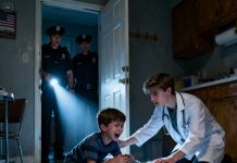 I grabbed the wrist of the eight-year-old boy when I noticed him trying to slip the bottle of medicine into his jacket. My manager yelled, “He’s stealing! Call the police!” The boy fell to his knees, tears pouring down: “Please… my mom can’t hold on anymore… she can’t breathe…” When officers broke into the run-down apartment, the sight inside left all of us frozen: his mother lay curled on the cold tile floor, her lips turning blue. The boy threw himself at her, hugging her and crying with a voice so small it could break anyone’s heart. And when they found out he had run almost three kilometers to get medicine for her, every single person… ended up in tears.