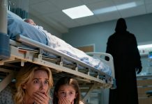 I had just given birth when my eight-year-old daughter ran into the hospital room, her eyes wide and alert. She closed the curtains, then whispered right against my ear: “Mom… get under the bed. Right now.” My heart clenched, but I did as she said. The two of us lay close together beneath the bed, trying to keep our breaths as quiet as possible. Suddenly, heavy footsteps entered the room. Just as I tried to look out, she gently covered my mouth—her eyes filled with a fear I had never seen before. And then…