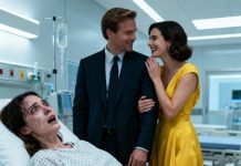 In my hospital room, I lay there unable to move while my husband whispered, “Once she’s gone, everything is ours.” The woman beside him smiled and replied, “I can’t wait, baby.” The nurse adjusting my IV glanced at them and said calmly, “She can hear every word you’re saying.”