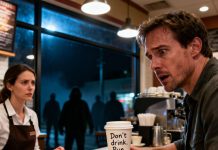 The barista wrote on my cup: “Don’t drink. Run.” I looked up. She met my eyes and shook her head: “You’re not safe.” My heart pounded as I set the cup down. I stepped outside—and saw someone waiting in the shadows. Three minutes later… I understood why that warning had just saved my life.