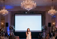 My dad threatened to cut my tuition if I skipped my golden sister’s wedding. I went—and realized the ceremony was a glamorous trap to force me into signing a debt that would ruin my future. “Sign it,” he whispered. I smiled and took the mic at the reception. “May I say a few words?” When the screen lit up, the music died. And from that moment on… his nightmare officially began.