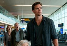 “Your ticket isn’t confirmed—just stay home,” my dad sneered at the airport. I watched my grandma clutch her suitcase, lips trembling, unable to speak. I turned to them and said quietly, “Then I’m staying too.” Three weeks later, they came back—only to freeze at the doorway when they saw me standing beside a stranger. And in that moment, I knew… everything was about to change.