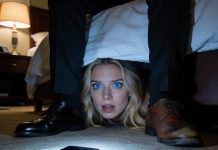 On my wedding night, I stifled a laugh as I hid under the bed, waiting for my husband to walk in so I could surprise him. The door opened—but it wasn’t him. A phone was placed on the floor, its speaker turned on. “Is she in the room?” a man’s voice asked. The other replied, “Don’t worry. She won’t suspect a thing.” I bit down hard to keep from screaming—because in that moment, I realized I had just overheard a secret that could destroy my entire life.