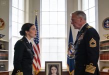 While inspecting a general’s office, my eyes stopped on a photograph on his desk. My heart skipped — I recognized that face. “Sir… this girl once lived with me,” I whispered. He went pale, his lips trembling. “You mean… my missing daughter?” The air froze. And I understood — the truth buried for so many years was about to surface.