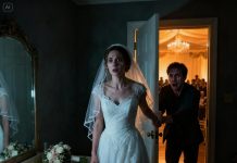 While I was still in my wedding dress in the bridal room, my husband suddenly burst in and seized my hand. “Cancel the wedding. We have to run—now!” I stared at him. “What are you talking about? The ceremony is about to start…” His eyes were shining with tears, his voice shaking. “I’ll explain later. Please—just trust me. We need to get out of here right now.” Before I could even process it, he dragged me out of the venue. And when he finally spoke again… I felt my whole body tremble with fear.