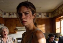 “He kept his headphones on, eyes glued to the screen, while his mother swung the rolling pin and screamed, ‘That’ll teach you to take out the trash!’ I didn’t fight back. I waited. When she finally slowed, I walked—calmly—toward the outlet. She saw it, froze, and shrieked, ‘No… not that!’ That’s when the power shifted.”