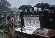I was standing by my daughter’s coffin when a voice called out from behind me, “She isn’t dead!” A homeless boy ran forward, shaking as he pointed at the coffin. I yelled at him to leave. But when he whispered something I had never shared with a single soul… my heart froze. And I realized I was about to confront a truth none of us were ready to face.