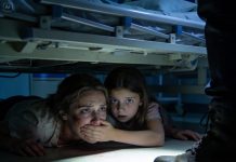 I had just given birth when my eight-year-old daughter ran into the hospital room, her eyes wide and alert. She closed the curtains, then whispered right against my ear: “Mom… get under the bed. Right now.” My heart clenched, but I did as she said. The two of us lay close together beneath the bed, trying to keep our breaths as quiet as possible. Suddenly, heavy footsteps entered the room. Just as I tried to look out, she gently covered my mouth—her eyes filled with a fear I had never seen before. And then…