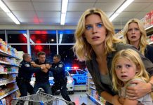 A little girl grabbed my arm in the cereal aisle and whispered, “My mom says pretend you know us. Please.” I forced a smile. “Sweetheart, what’s going on?” Her fingers tightened. “That man is following us.” I glanced over her shoulder—and froze. I recognized him from the security briefing at work. My heart started racing. If she knew who he was too, then this wasn’t just fear. It was something far worse.