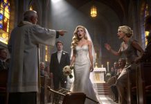At my wedding, just as I was about to say “I do,” the priest leaned closer and whispered, “I can’t continue this ceremony.” I thought he was joking—until he turned and pointed directly at my groom’s mother. The room fell silent. “She knows why,” he said. My fiancé went pale. Guests began whispering. And in that suspended moment before the truth came out, I realized this wasn’t a blessing—it was a warning.