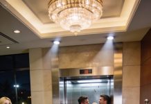 The lobby was quiet until the receptionist pressed the room key into my palm and whispered, “Don’t use the elevator.” I frowned. “Is it broken?” She leaned closer. “Please. Take the stairs.” The lift dinged at that exact moment, doors parting slowly. A man stepped out, scanning the lobby like he was looking for someone. And when his eyes locked onto mine, I understood why she had rushed me.