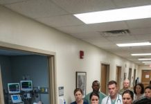 The young soldier, critically wounded, lay completely still on the hospital bed. Out in the hallway, his father broke down, loudly accusing the bride-to-be of being the reason this happened—until the combat camera footage was pulled up for all to see.