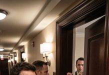 When I saw my wife’s car parked outside the same hotel she once called “our favorite getaway,” something inside me went cold. I texted her: “Where are you?” She replied instantly, “Working late at the office.” I stared at the hotel entrance and laughed quietly. “Interesting,” I told the sheriff standing next to me. “Because her boss just checked in with her ten minutes ago.” Then we started walking toward their room.