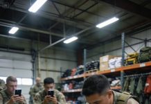 They laughed when they cut her uniform, thinking they’d humiliated her in front of everyone. The torn fabric hung loose as the crowd watched, expecting anger or tears. Instead, the Navy SEAL went completely still. One second later, the laughter stopped—because they realized they had just messed with the wrong person.