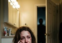 For months, I hid the bruises my husband left whenever his mistress fed him another lie. That night, he slammed me into the kitchen wall so hard I tasted blood. Locked inside the bathroom, I finally called my father. “Dad,” I whispered, shaking, “you were right about him.” His voice turned cold. “Stay exactly where you are. I’m bringing someone he never expected to face.”