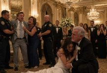 My fiancé demanded that I wear his mother’s thirty-year-old wedding dress because buying my own would be “a selfish waste of money.” I refused, paid for the gown I loved myself, and walked down the aisle wearing it anyway. Halfway through the ceremony, he saw the dress, grabbed my arm, and slapped me across the face in front of everyone. “You’re unbelievable! All you know how to do is spend money!” he shouted. His mother actually started clapping. “Good. She needed someone to teach her a lesson.” The chapel went dead silent. I didn’t hit him back. I simply turned toward my parents. My father was already standing—and the expression on his face made my fiancé’s mother stop clapping.