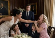 My sister-in-law slapped me at my own anniversary dinner because I served myself before her. “You forget your place in this family,” she snapped, while my husband sat there and looked away. I slowly set down my fork and slapped her back. The entire table went silent. She expected me to apologize, cry, or beg for forgiveness. Instead, I calmly stood up and said, “You’re right. We need to talk about my place in this family.” Then I pulled a folder from my purse—and my husband’s face instantly changed when he saw what was inside.